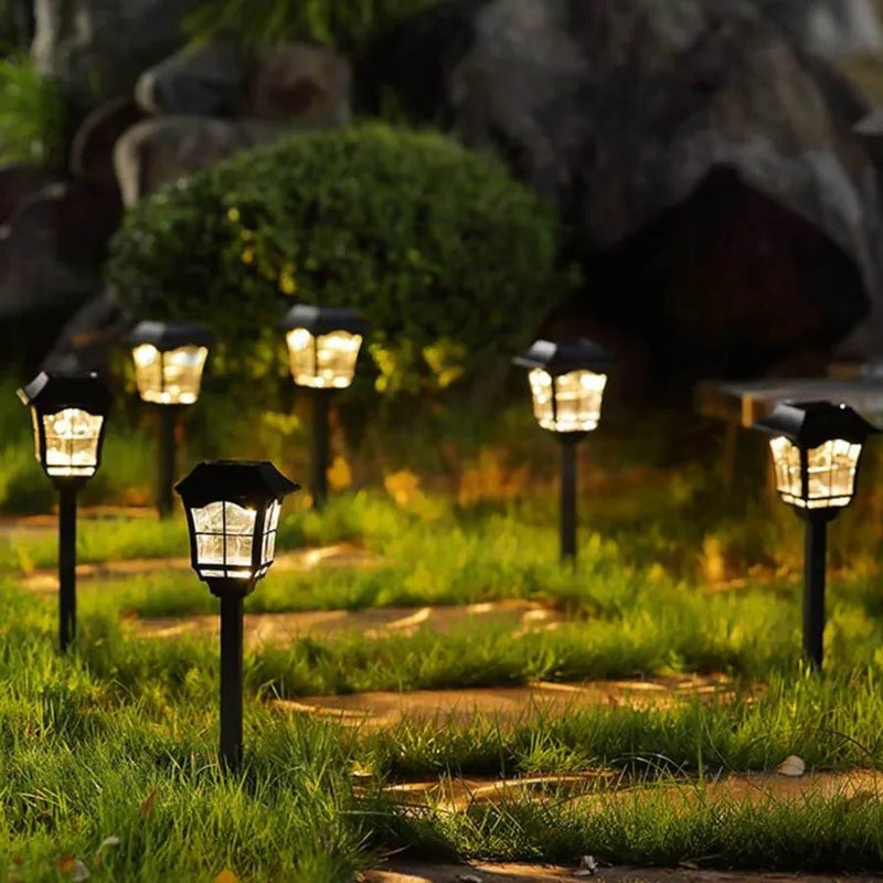 Lámpara solar estaca instalada en sendero jardín sin cables ni electricidad – Olimantech